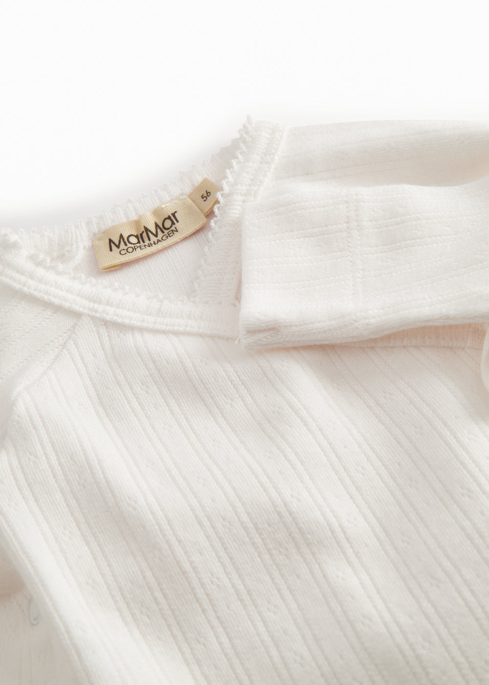 White pointelle bodystocking for newborns