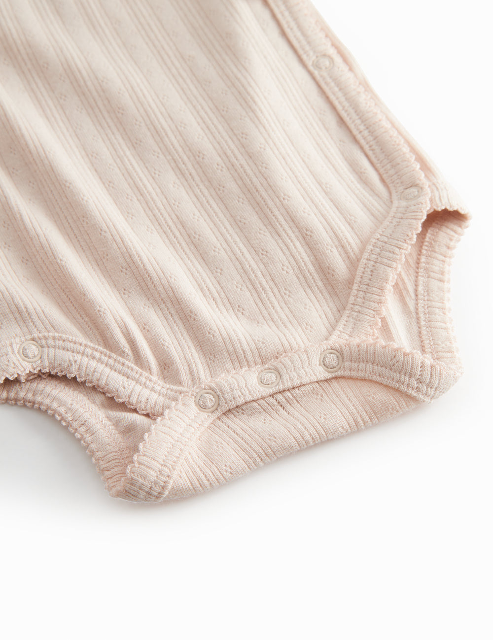 Langærmet lyserød pointelle bodystocking for newborns