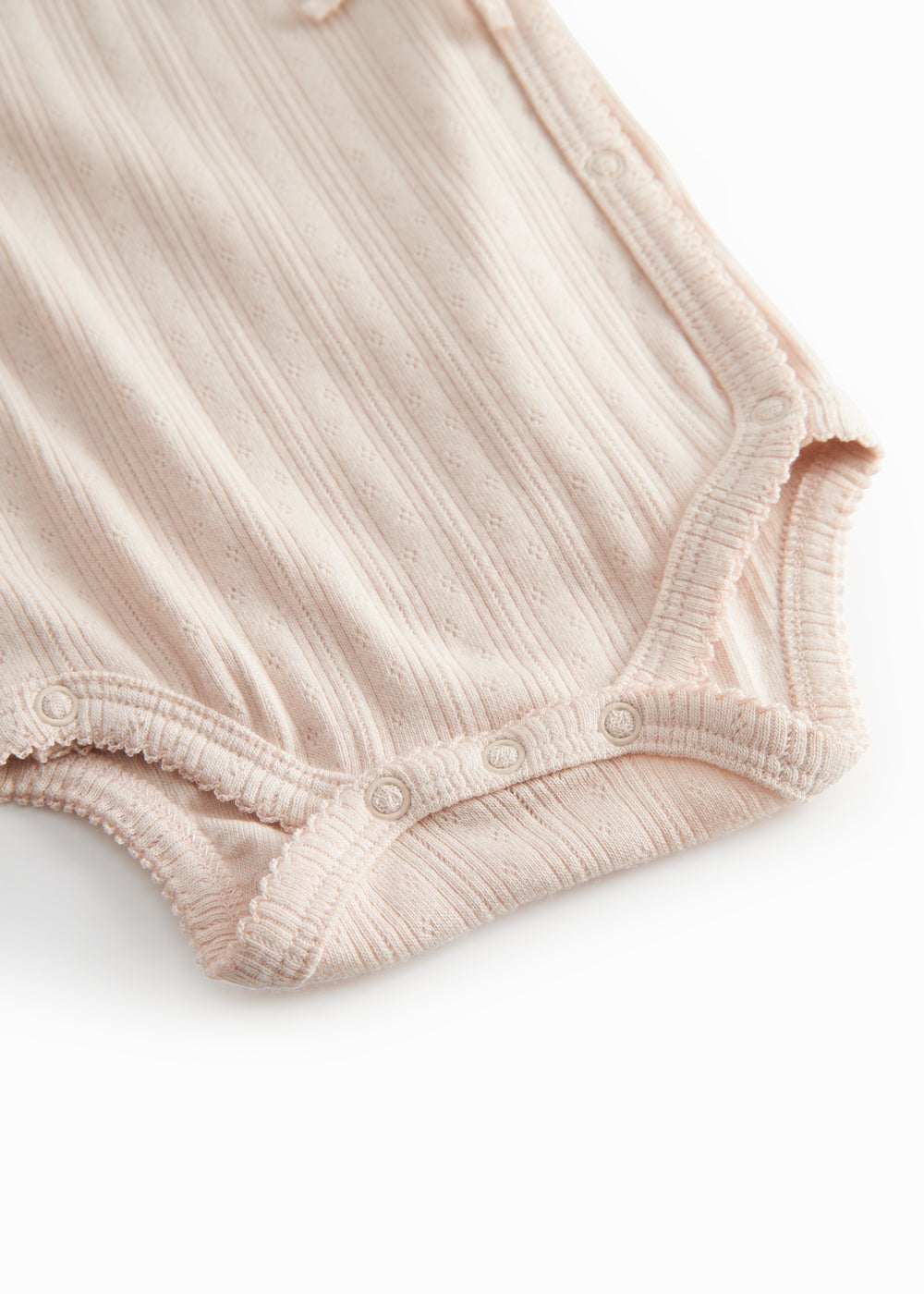 Langærmet lyserød pointelle bodystocking for newborns