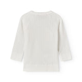 Fleece pointelle blouse for newborns with a wrap-around closure.