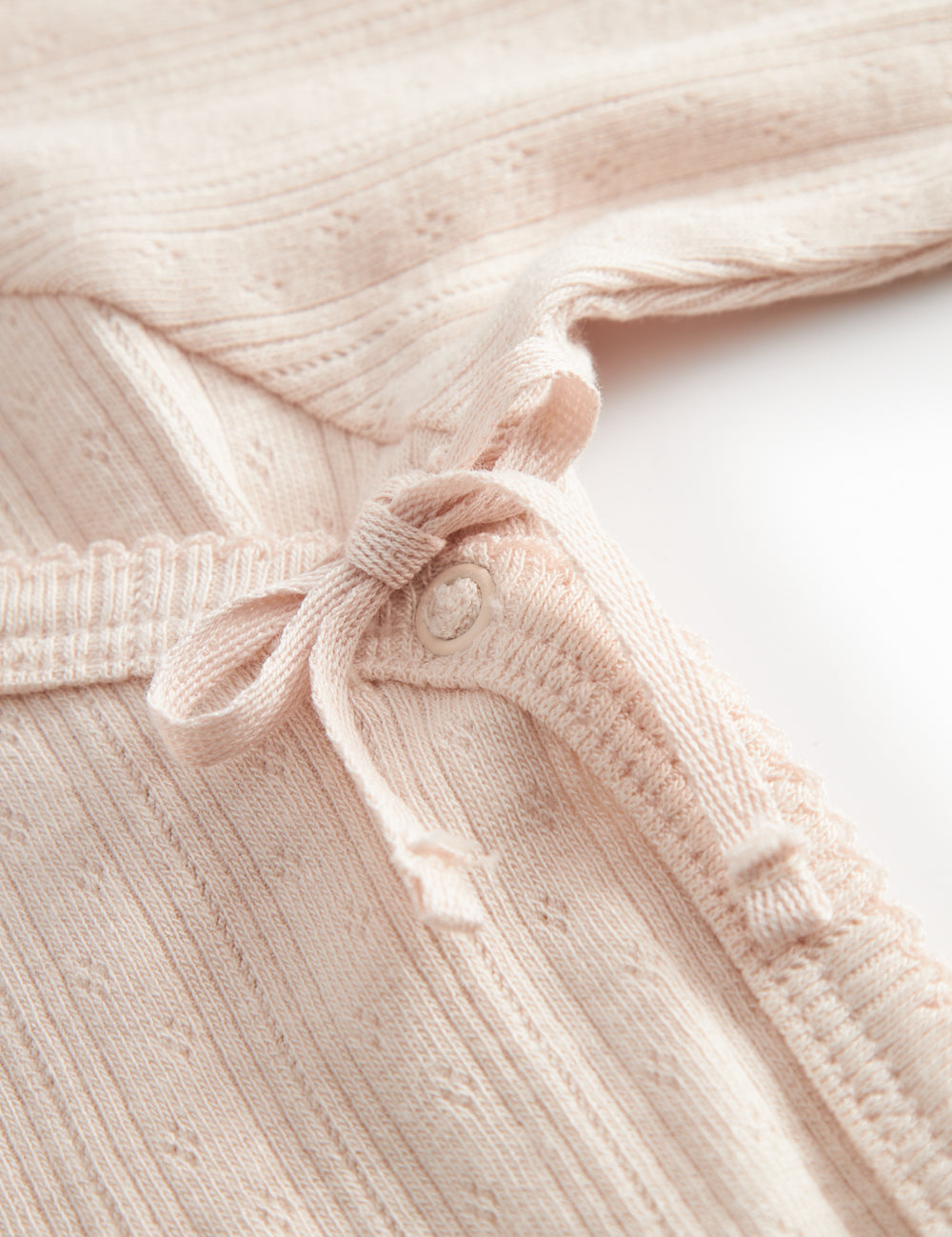 Langyarn red pointelle blouse for newborns with a wrap-around closure