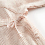 Langyarn red pointelle blouse for newborns with a wrap-around closure