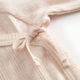 Langyarn red pointelle blouse for newborns with a wrap-around closure