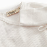 White long-sleeved pointelle onesie with a snap closure for newborns