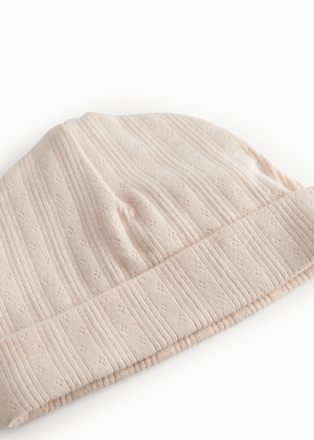 The baby hat in red with a contrasting edge.