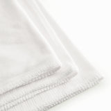 White cotton baby blanket with rounded corners and picot edges.
