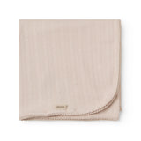 Red polka dot baby blanket with rounded corners and picot edges.