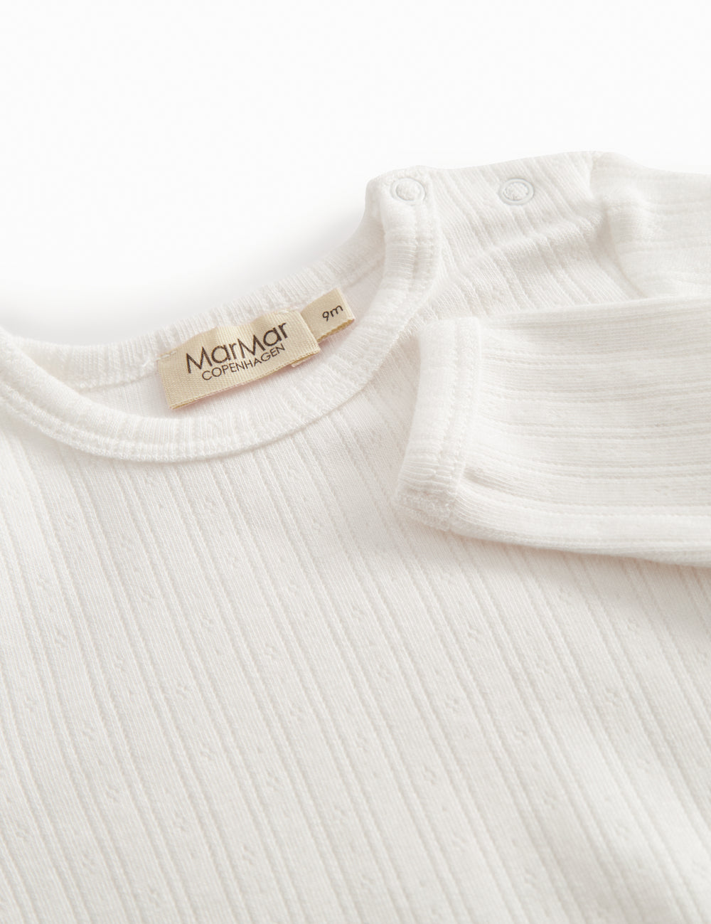 Langärmet hvid pointelle baby bodystocking