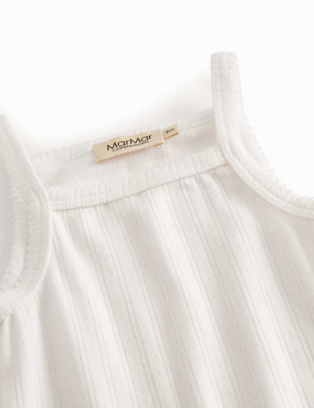 Baby bodystocking without sleeves with garters