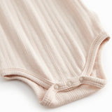 Red baby bodystocking without sleeves with garters