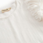 Short-sleeved white polka dot t-shirt for children with cuffs on the sleeves.