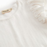 Short-sleeved white polka dot t-shirt for children with cuffs on the sleeves.