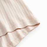 Short-sleeved bright pink polka dot t-shirt for children with cuffs on the sleeves.