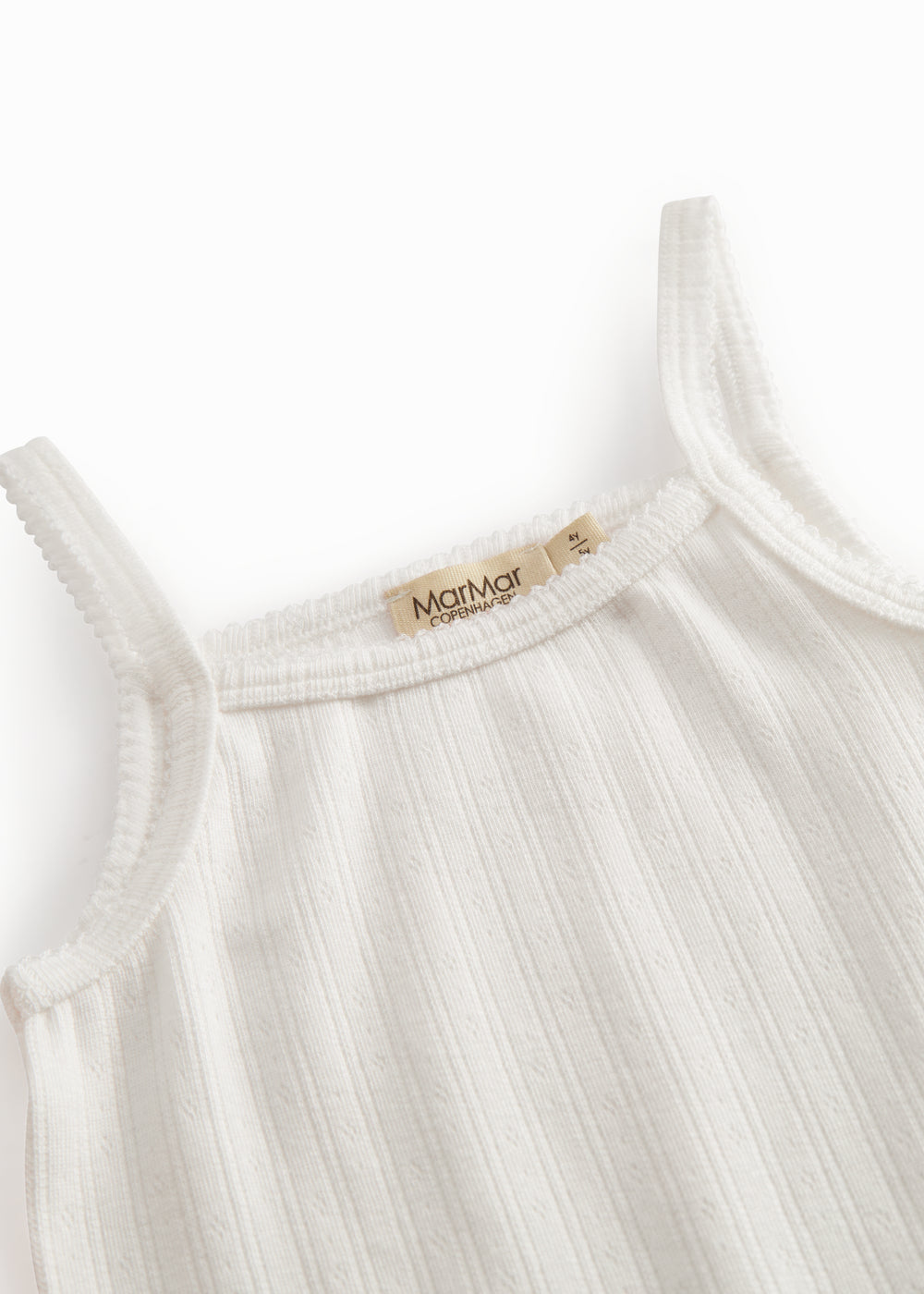 White t-shirt for children with pique details and thin straps.