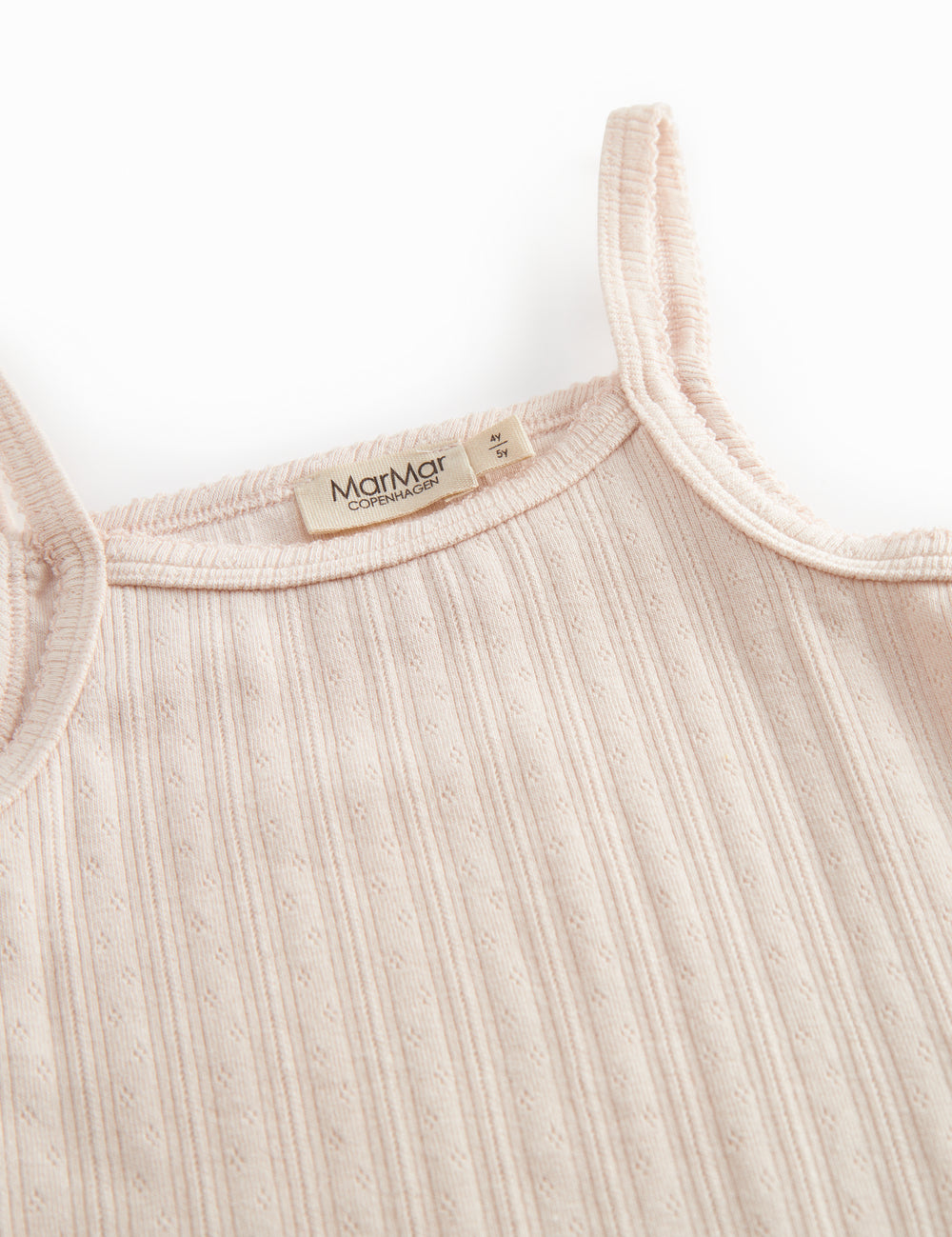 Red undershirt for children with embroidered details and thin straps.