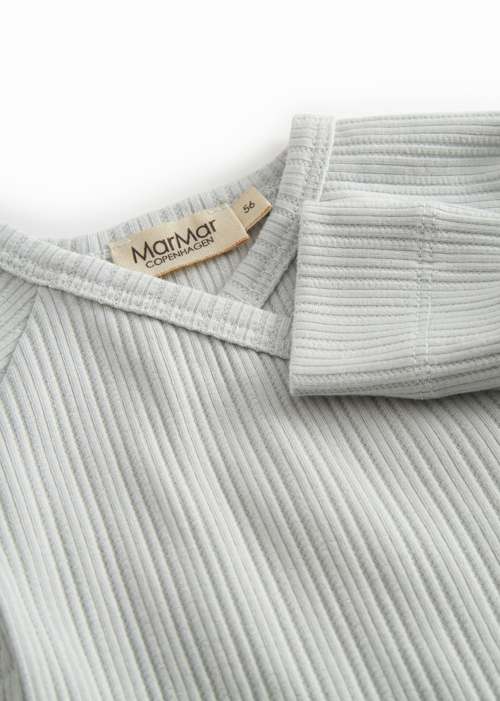 Light green pointelle blouse for newborns with a wrap-around closure.