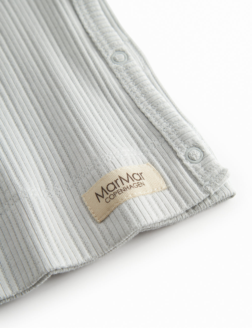 Light green pointelle blouse for newborns with a wrap-around closure.