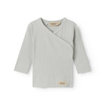 Light green pointelle blouse for newborns with a wrap-around closure.