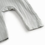 Lime green long-sleeved pointelle held with a and button for