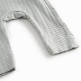 Lime green long-sleeved pointelle held with a and button for