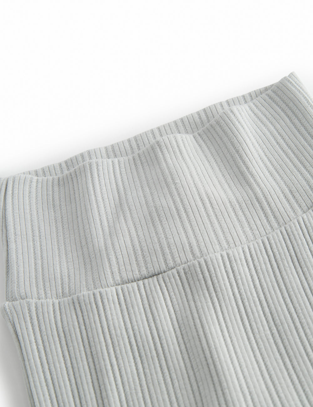 Green pointelle pants with feet for a newborn baby