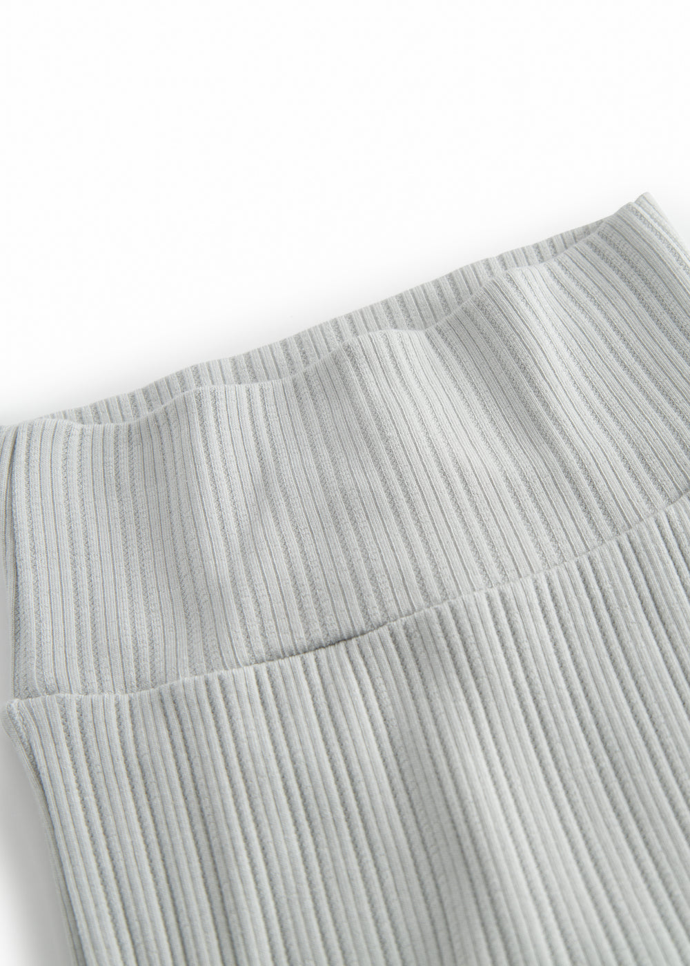 Green pointelle pants with feet for a newborn baby