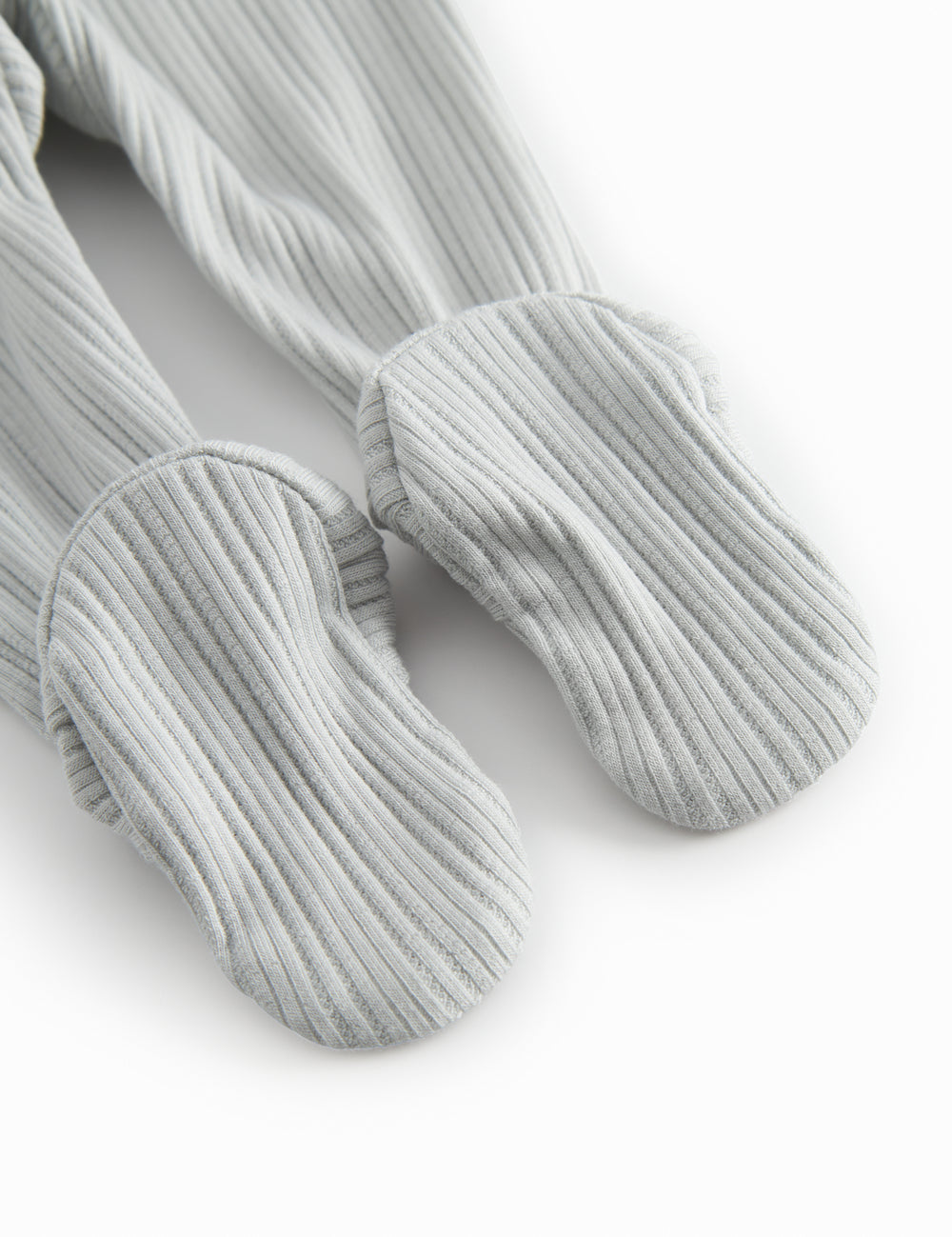 Green pointelle pants with feet for a newborn baby