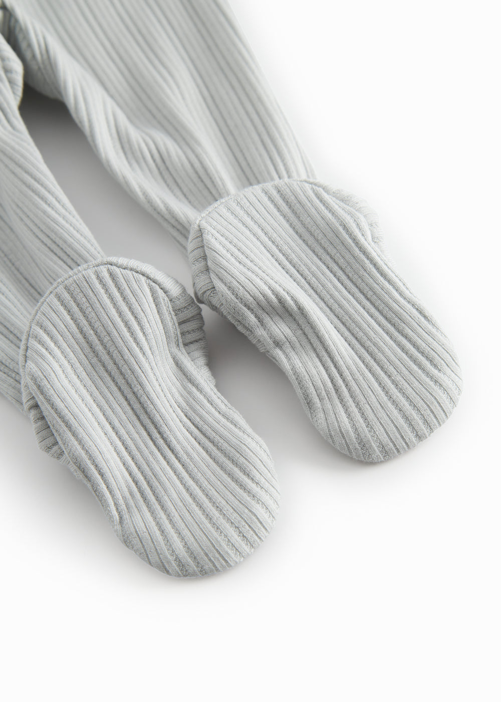 Green pointelle pants with feet for a newborn baby