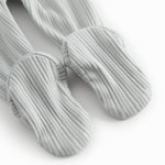 Green pointelle pants with feet for a newborn baby