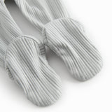 Green pointelle pants with feet for a newborn baby