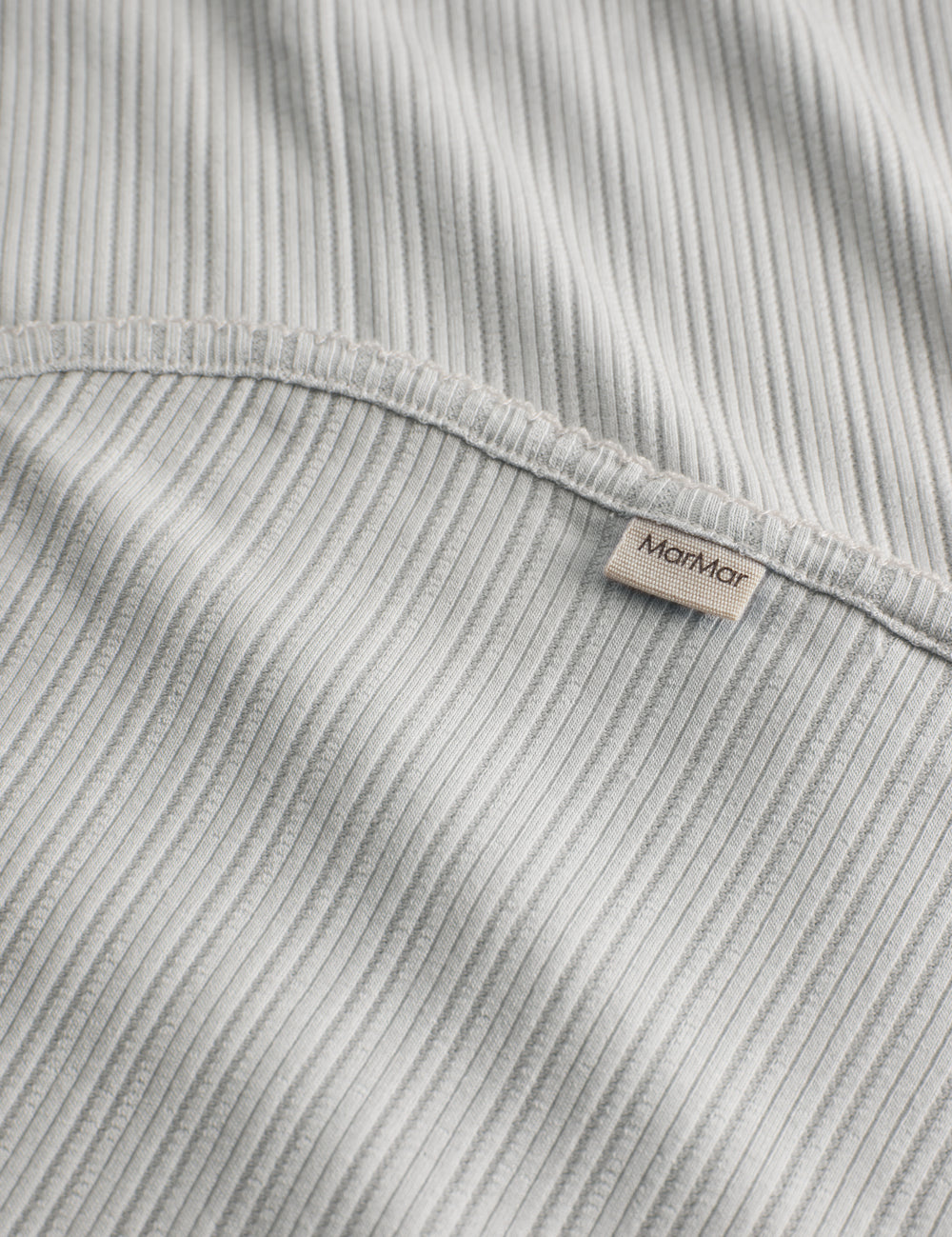 Lime green pointelle baby blanket with rounded corners and picot edges