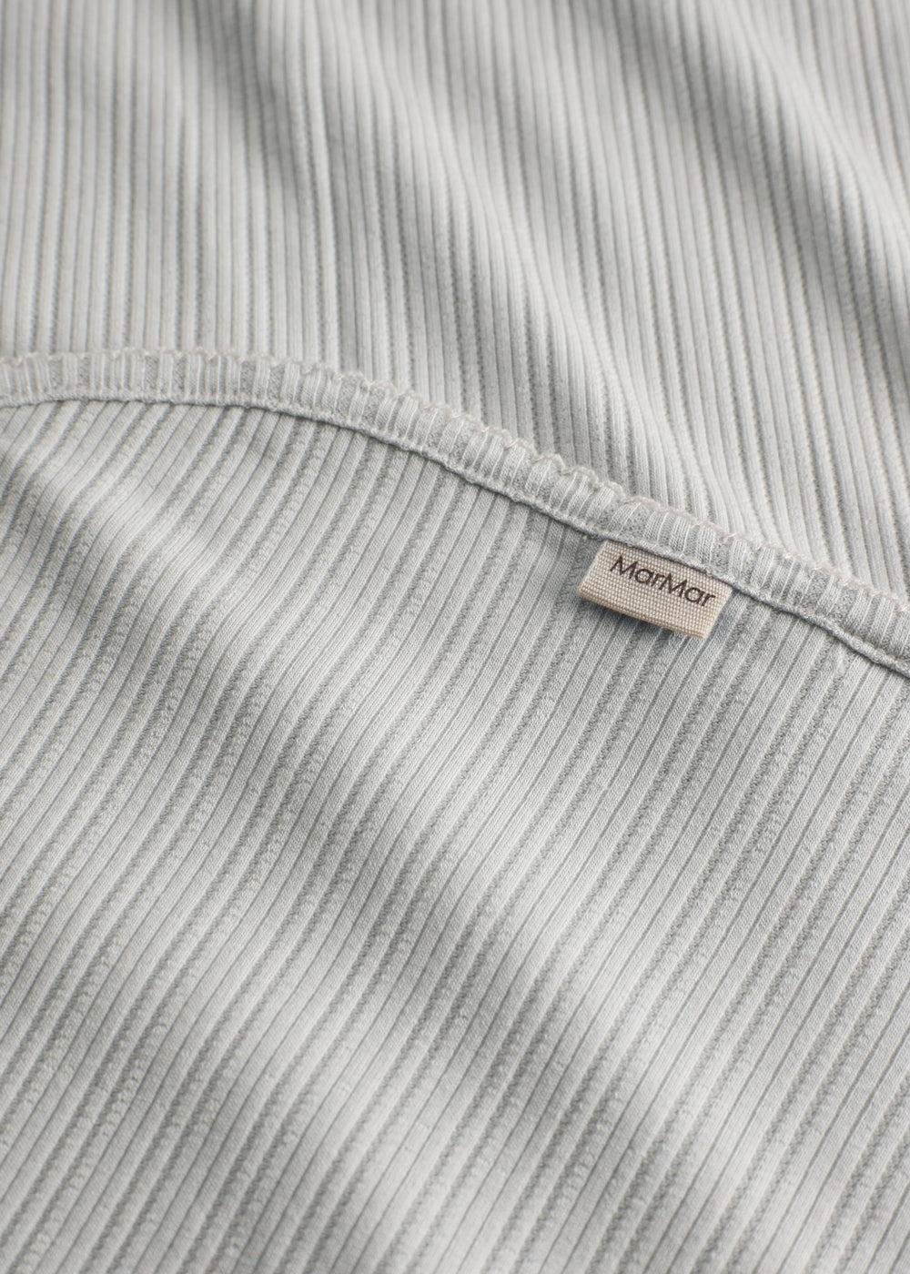 Lime green pointelle baby blanket with rounded corners and picot edges