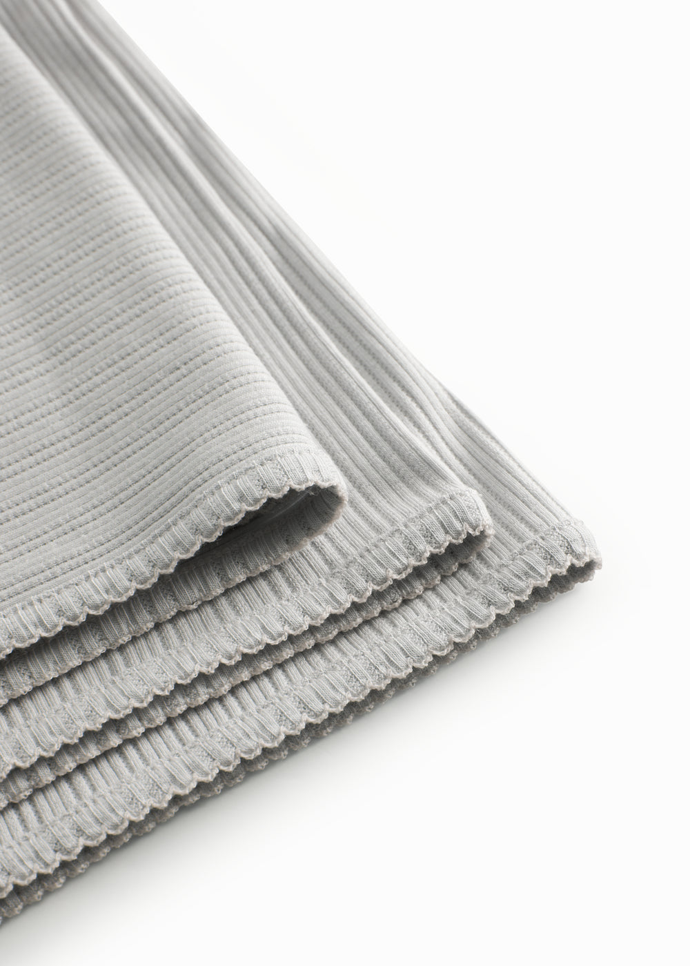 Lime green pointelle baby blanket with rounded corners and picot edges