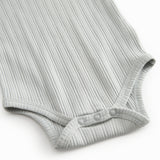 Langærmet lysegrøn pointelle baby bodystocking