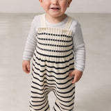 Children wearing striped sweater vests for babies with sleeves.