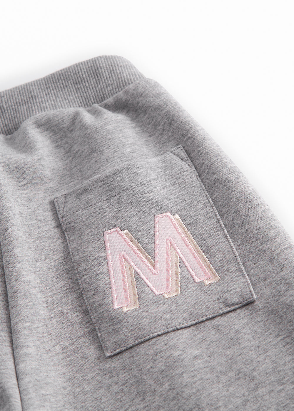 Gray sweatpants for children with a pink MarMar logo on the pocket and drawstring.