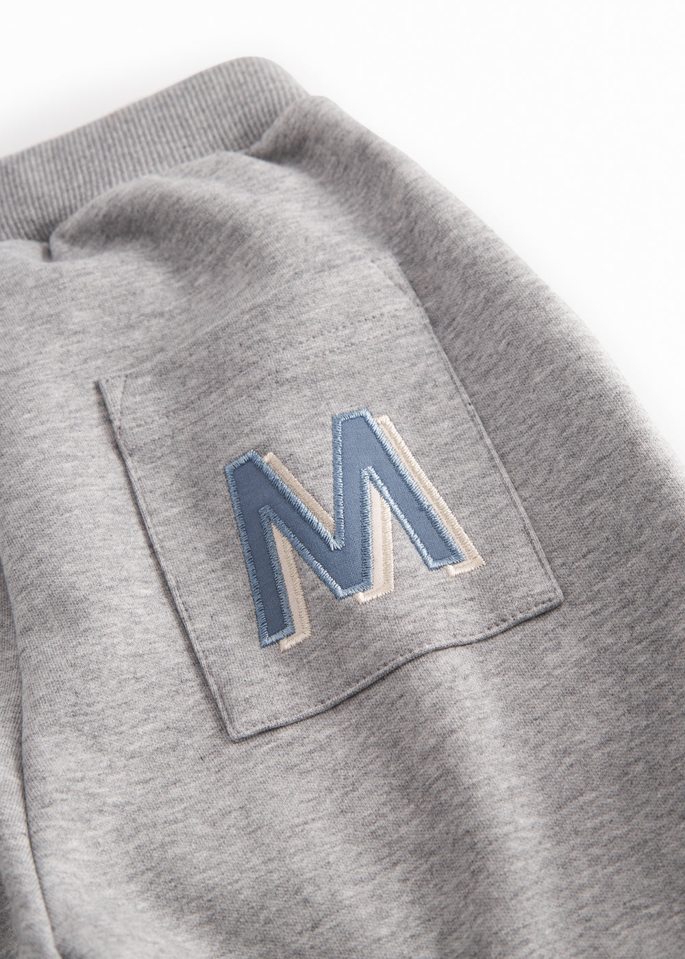 Gray sweatpants for children with the MarMar logo on the pocket and drawstring.
