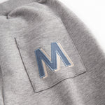 Gray sweatpants for children with the MarMar logo on the pocket and drawstring.