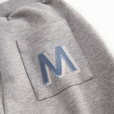 Gray sweatpants for children with the MarMar logo on the pocket and drawstring.