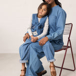 Adults and children wearing denim in matching shades.