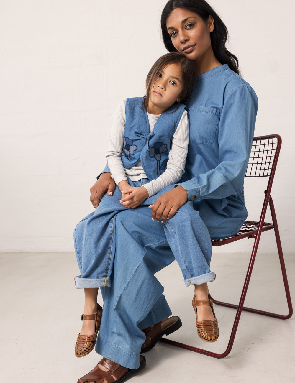 Woman and child wearing matching blue denim outfits