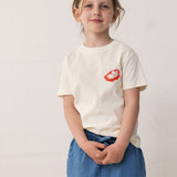 Child wearing a T-shirt and blue denim shorts