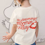 Children wearing Moomin T-shirts and blue denim shorts.