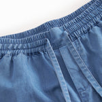 Denimshorts til børn med sidelommer og elastik i livet med bindebånd