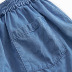 Denimshorts til børn med sidelommer og elastik i livet med bindebånd