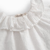 White baby bodysuit with a patterned design and collar