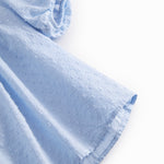 Kortærmet bluse til børn med puffærmer og fint broderimønster