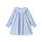 Light blue dress with embroidered pattern, elastic at the cuffs, and round neckline with wavy edges.