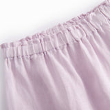 Light pink baby pants with a loose fit and elastic waist.