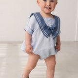 Bay window short-sleeved jacket with sailor collar and decorative bow.